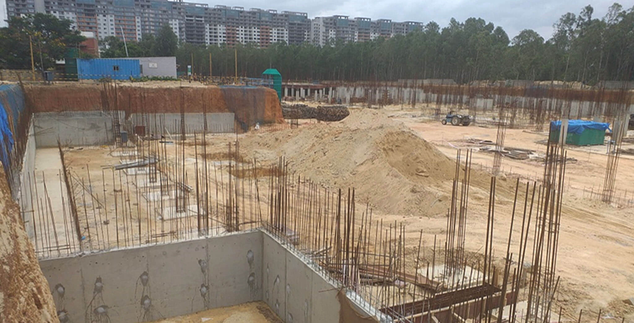 Aug 2019 - South side view: Rainwater Sump-04 wall concreting completed • D and C Block Retaining wall Concreting completed • D and E Block footings under progress