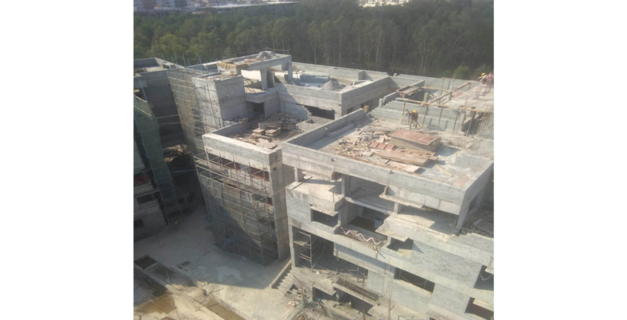 Mar 2020 - North side view: N & P Blocks—Above terrace works in progress; internal wall plastering works in progress; N Block—External wall plastering works in progress