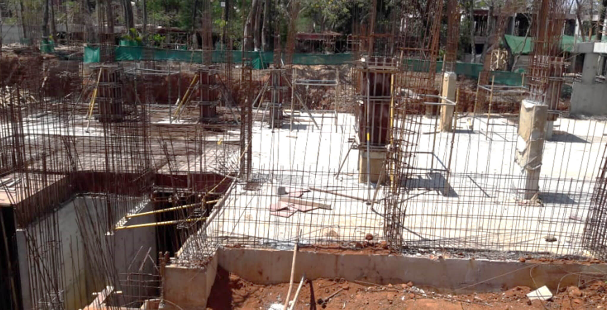 Mar 2020 - C Block: Stilt to Ground floor column work; retaining wall reinforcement work-in-progress.