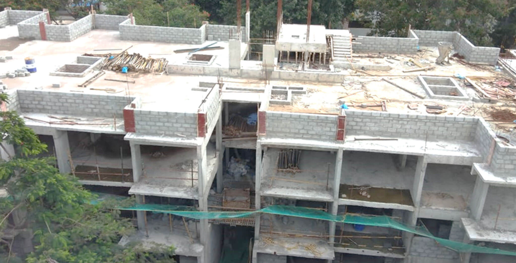 Jun 2020 - F Block: Above terrace floor parapet wall block work-in-progress; Block work completed up to 2nd floor.