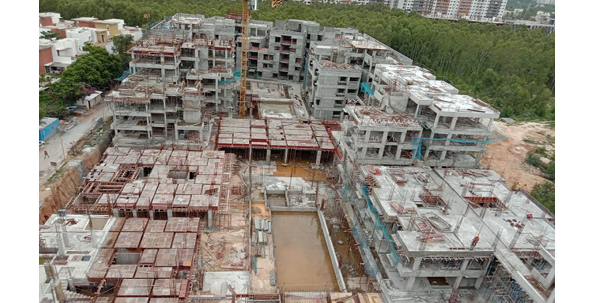 Jul 2020 - West side view: R Block–2nd floor slab shuttering work-in-progress; Podium shuttering work-in-progress near H Block GF
F & G Blocks—GF shuttering and rebar work-in-progress.