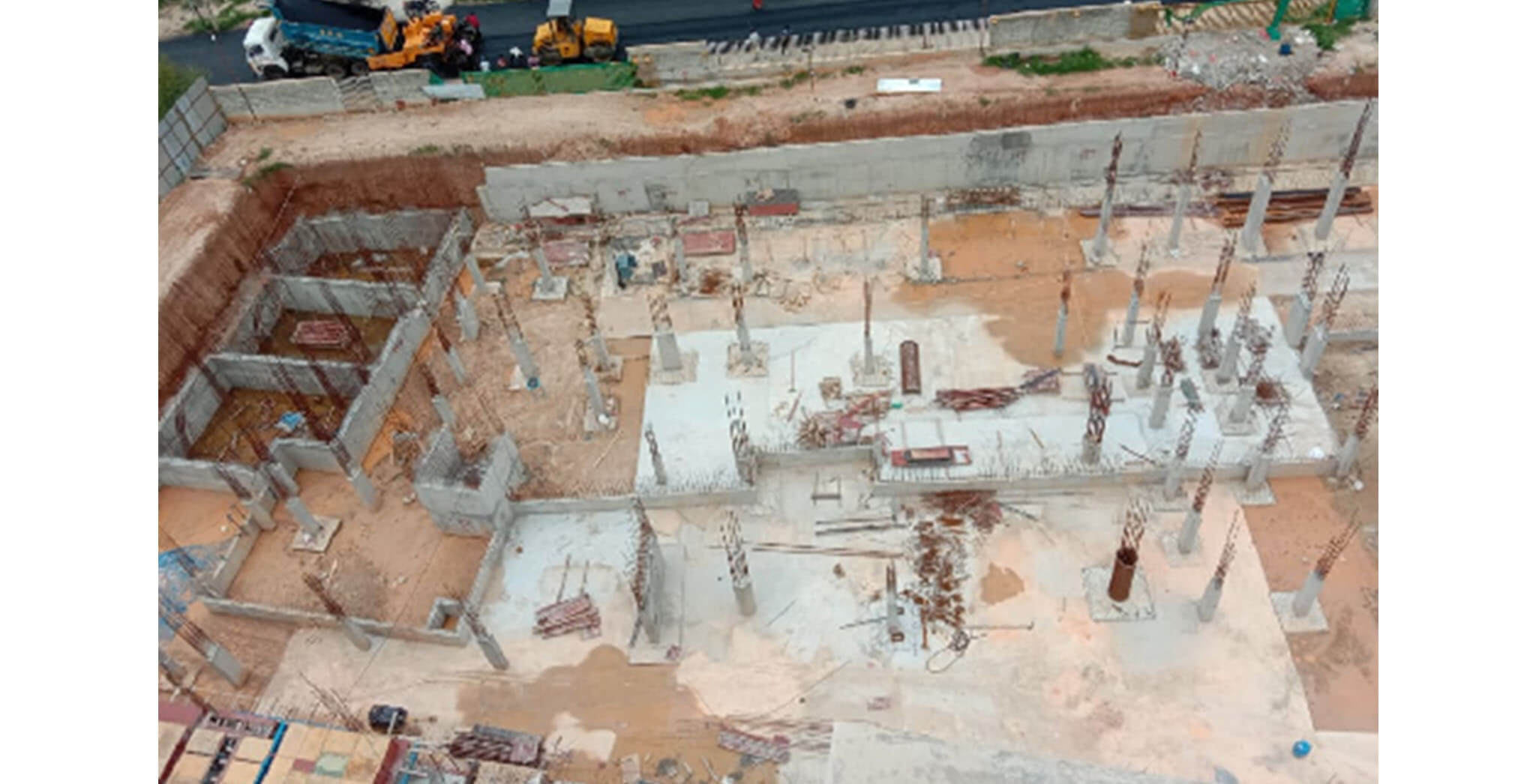 Jul 2020 - East side view: B & C Blocks—Grade slab PCC work-in-progress; UG Sump wall first lift completed, 2nd lift rebar tying work-in-progress.
