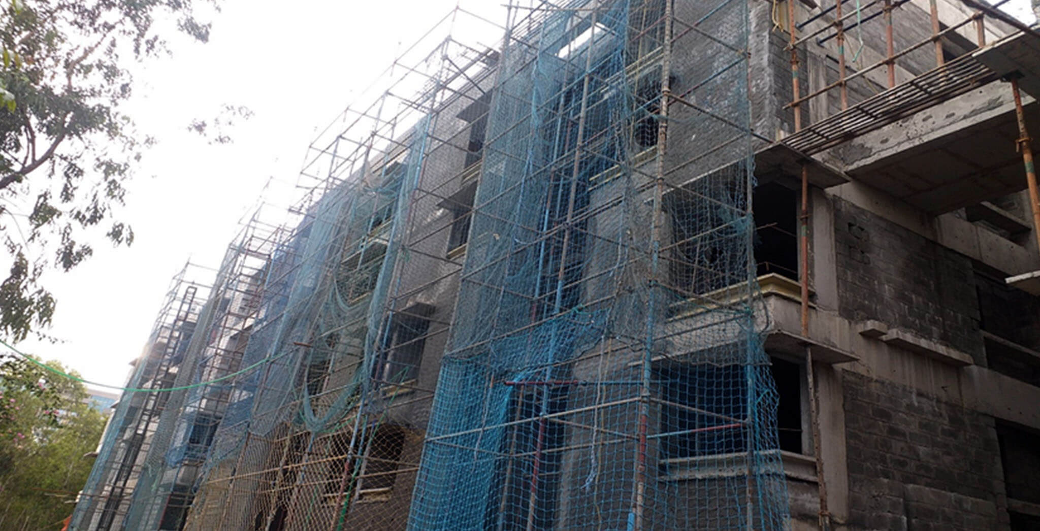 Aug 2020 - South side view: K Block—internal flat plastering completed, corridor and external plastering work-in-progress.