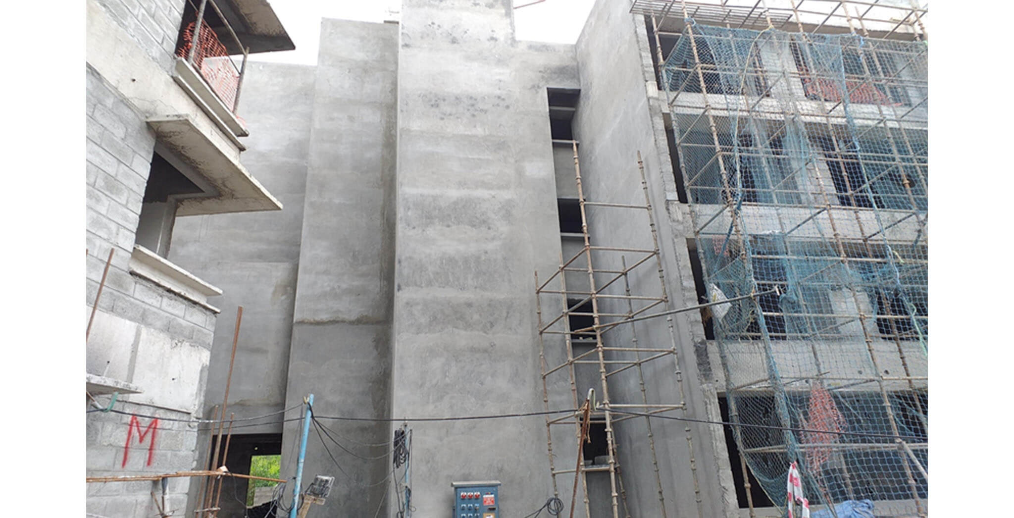 Aug 2020 - North side view: N Block—External wall plastering work-in-progress.