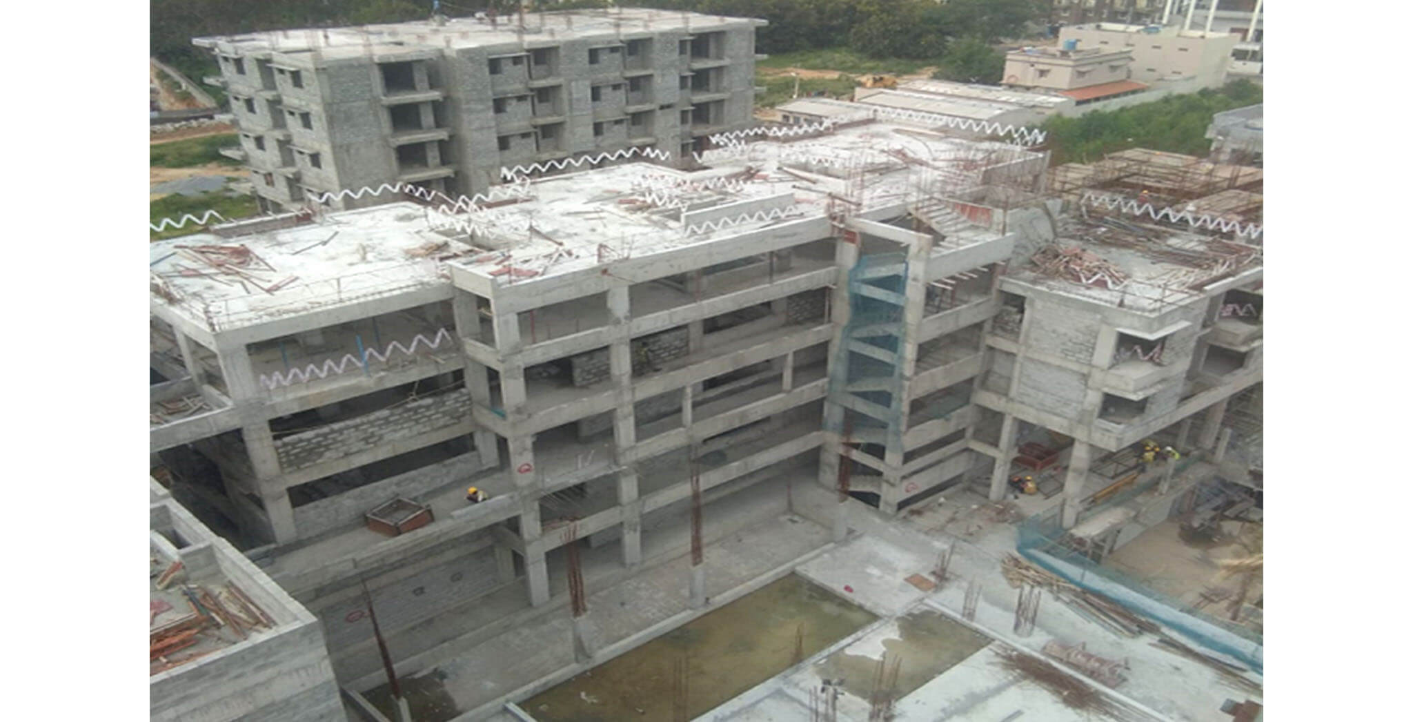 Aug 2020 - North side view: Q Block—Terrace floor slab completed; 2nd floor blockwork in progress.