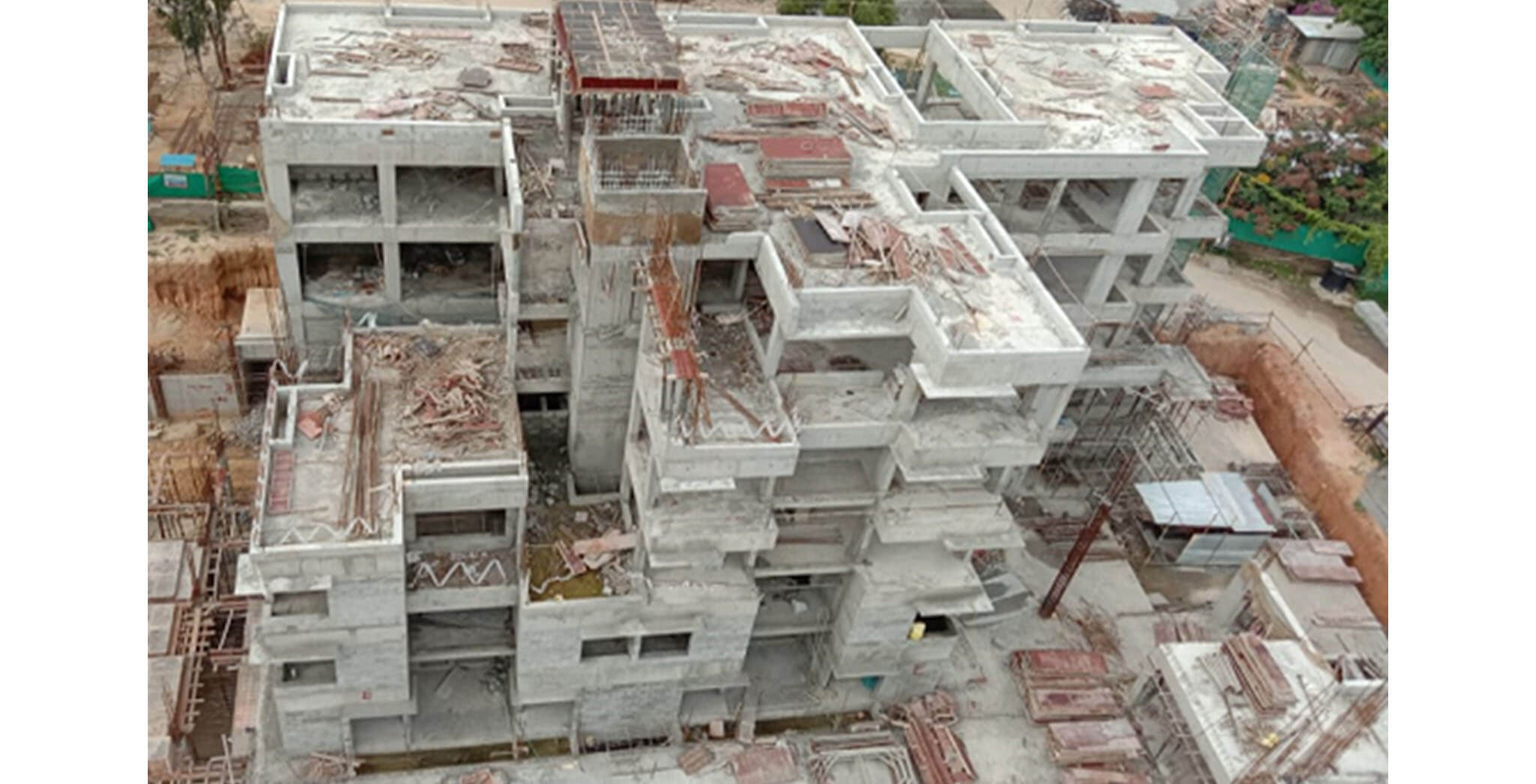 Aug 2020 - South side view: E Block—Terrace floor slab completed; blockwork at second floor level in progress.