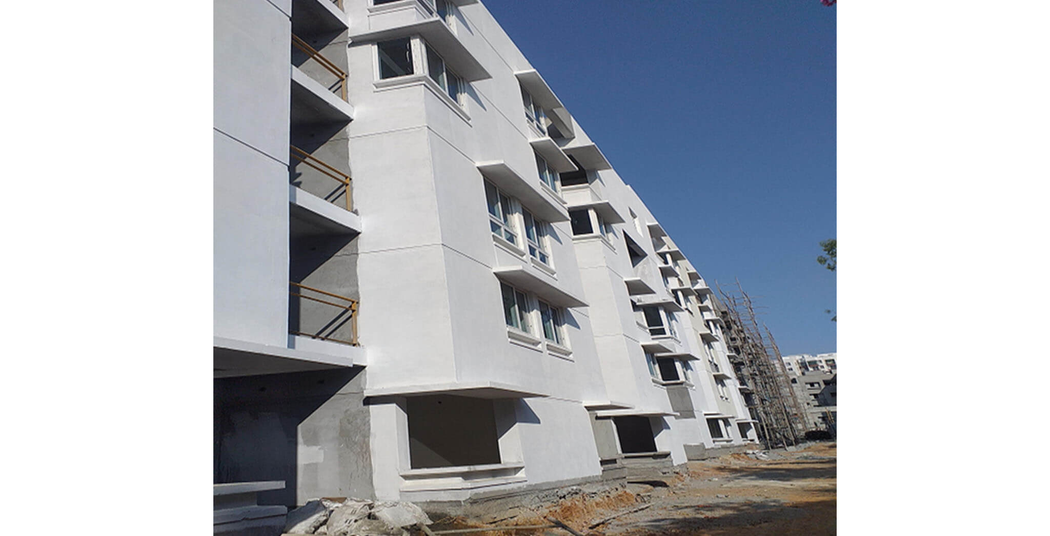 Feb 2021 - South side view: K & L Blocks—South side external wall Primer work-in-progress