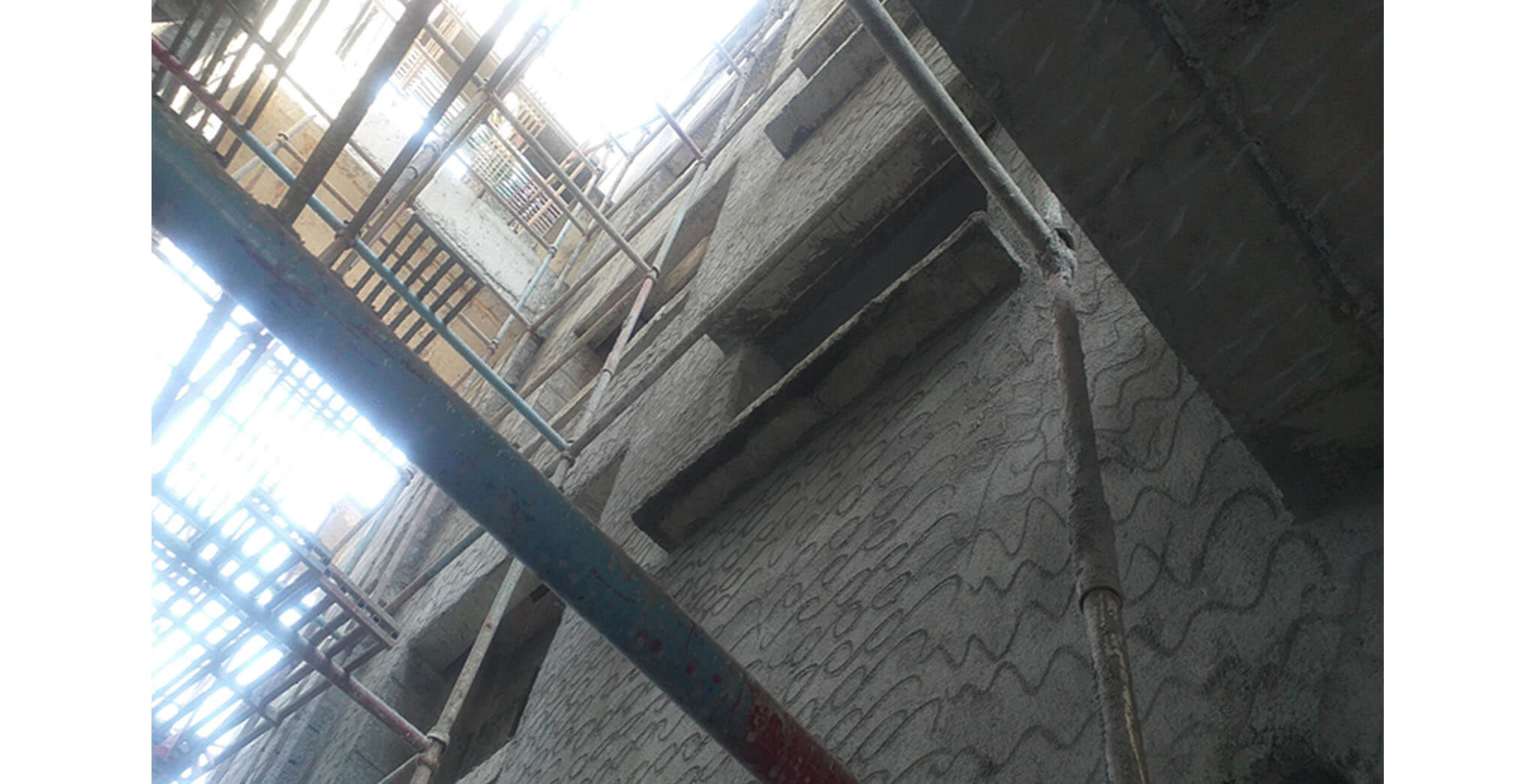 Feb 2021 - West side view: P Block—West side wall external plastering work-in-progress