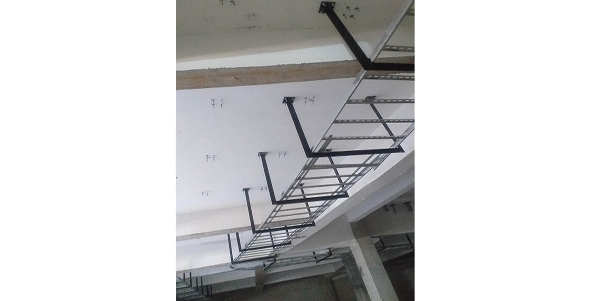Feb 2021 - Basement ceiling view: Cable tray in progress at J, K, L, M, N & P blocks