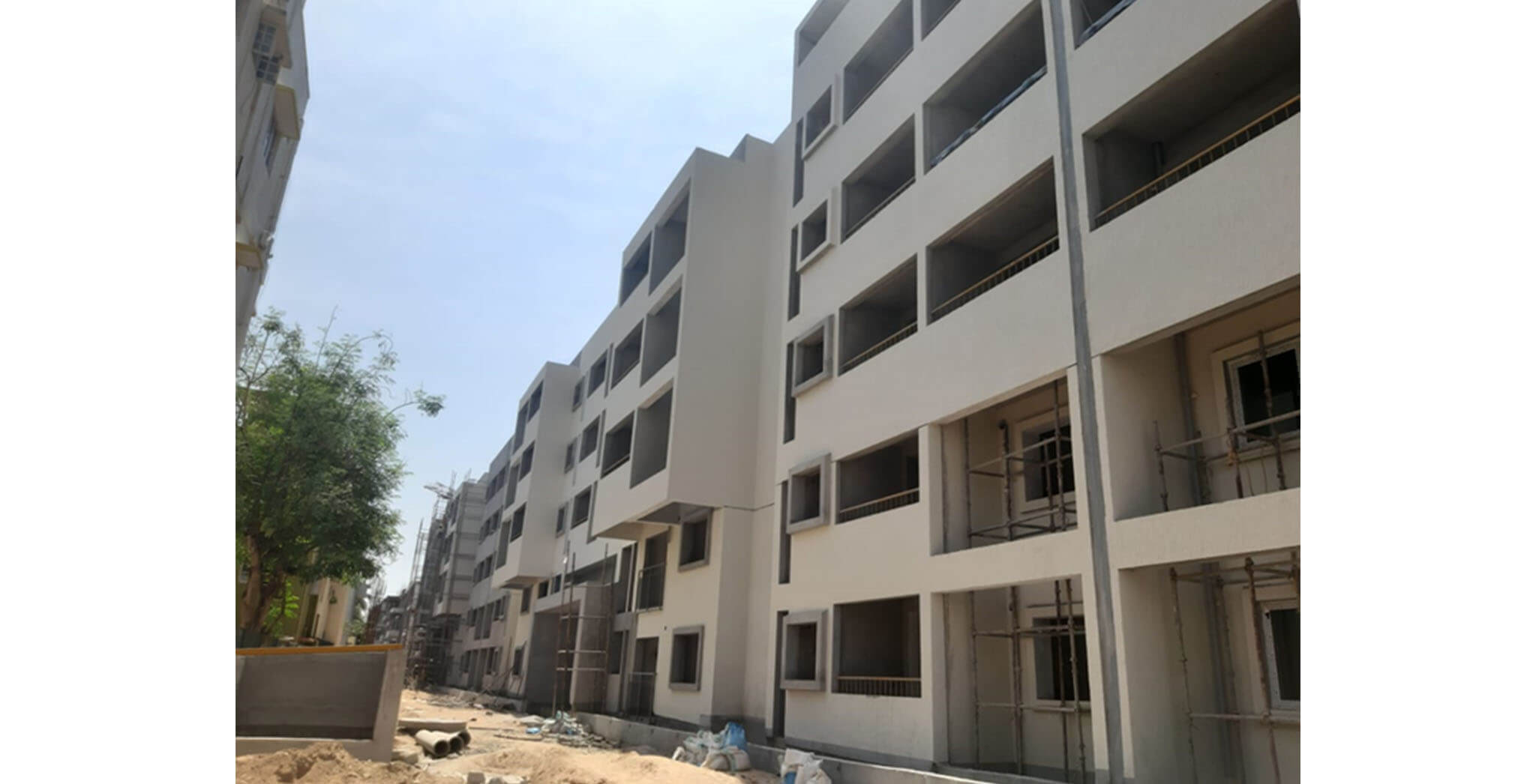 Apr 2021 - Towers I, J, O, and P: North side external plastering work completed and texture work-in-progress