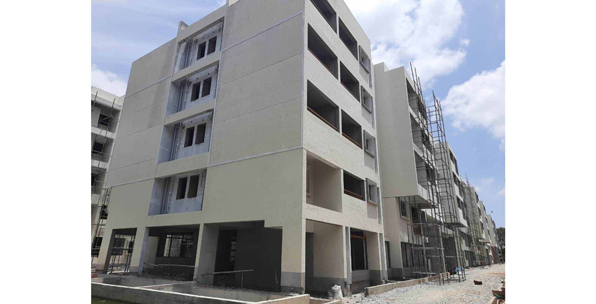 May 2021 - Towers G, H, Q, and R: External plastering work and texture work under progress