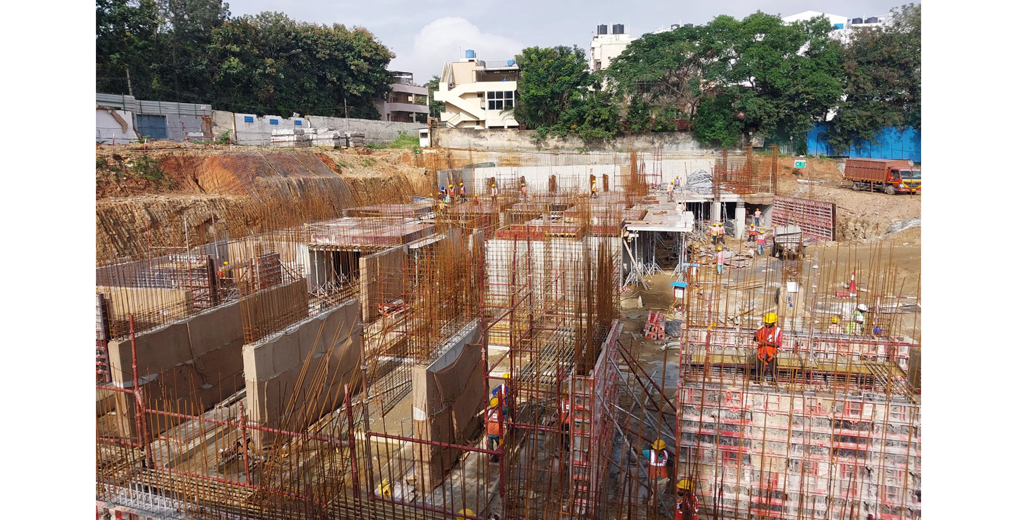 Oct 2022 - Brigade Nanda Heights Tower A (view from East side): Basement raft concreting completed & Upper basement slab works are in progress