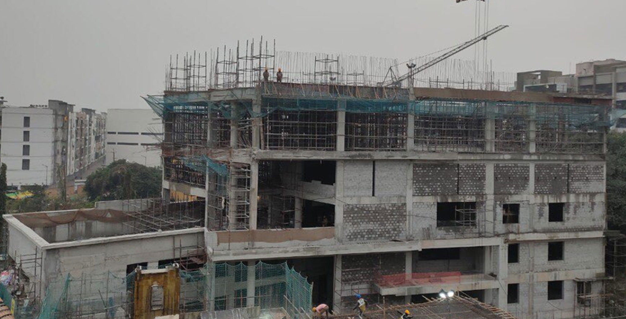 Dec 2022 - Clubhouse: Ground Floor to Terrace Structure completed. GF, 1st, 2nd & 3rd Floor Block work & Plastering WIP. Above Terrace Structure works in progress