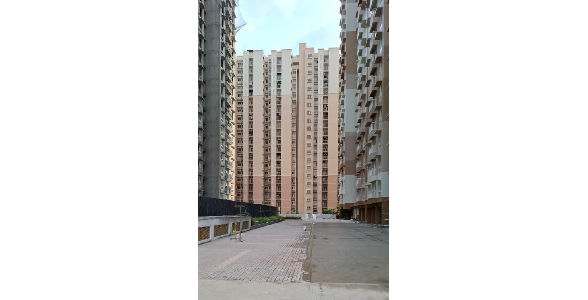  East face( between E and D tower) driveway and car parking work is completed - Status Images 22